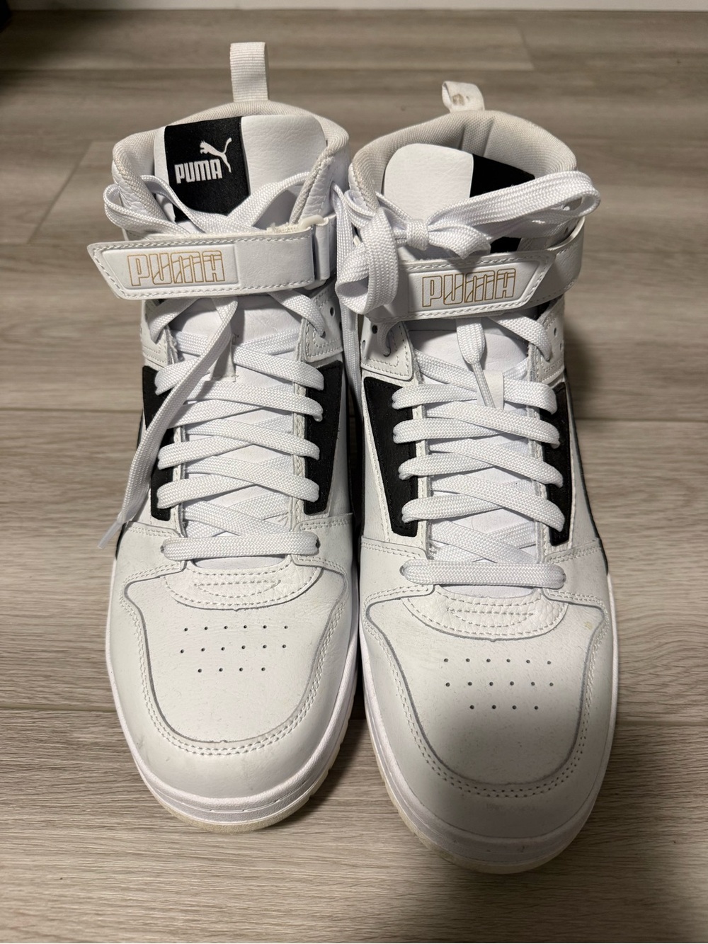 Puma White and Black High-Top Sneakers with Gold Logo